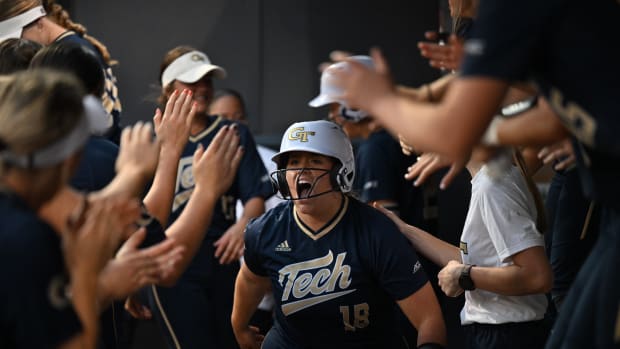 Sara Beth Allen in dugout after homerun